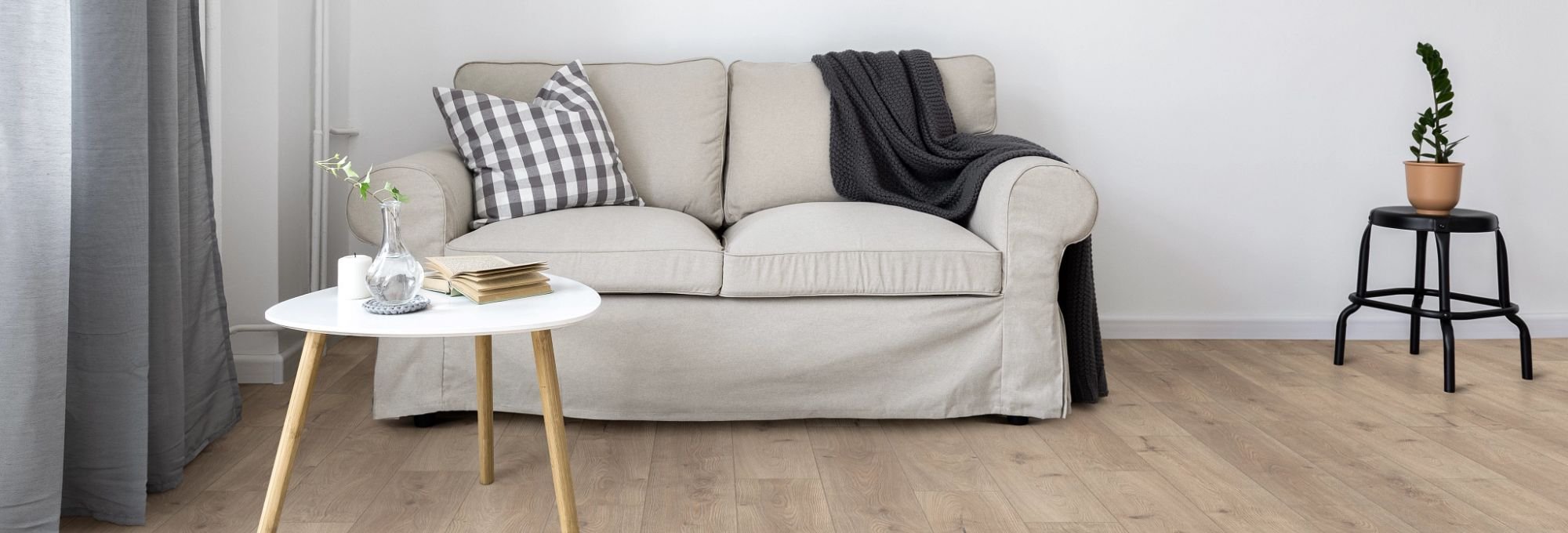 white table and white sofa on hardwood from U Payless Flooring in Schumacher