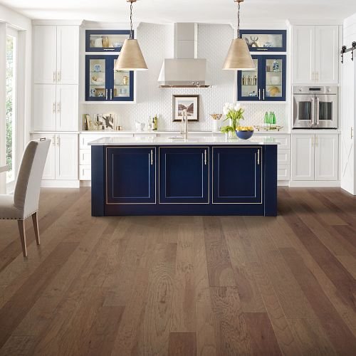 Brown hardwood and a blue countertop from U Payless Flooring in Schumacher
